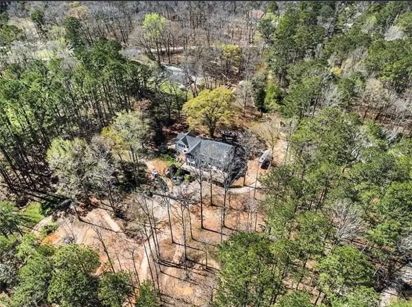 a living room with furniture a rug and a chandelier