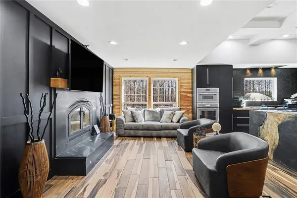 a living room with furniture and a large window