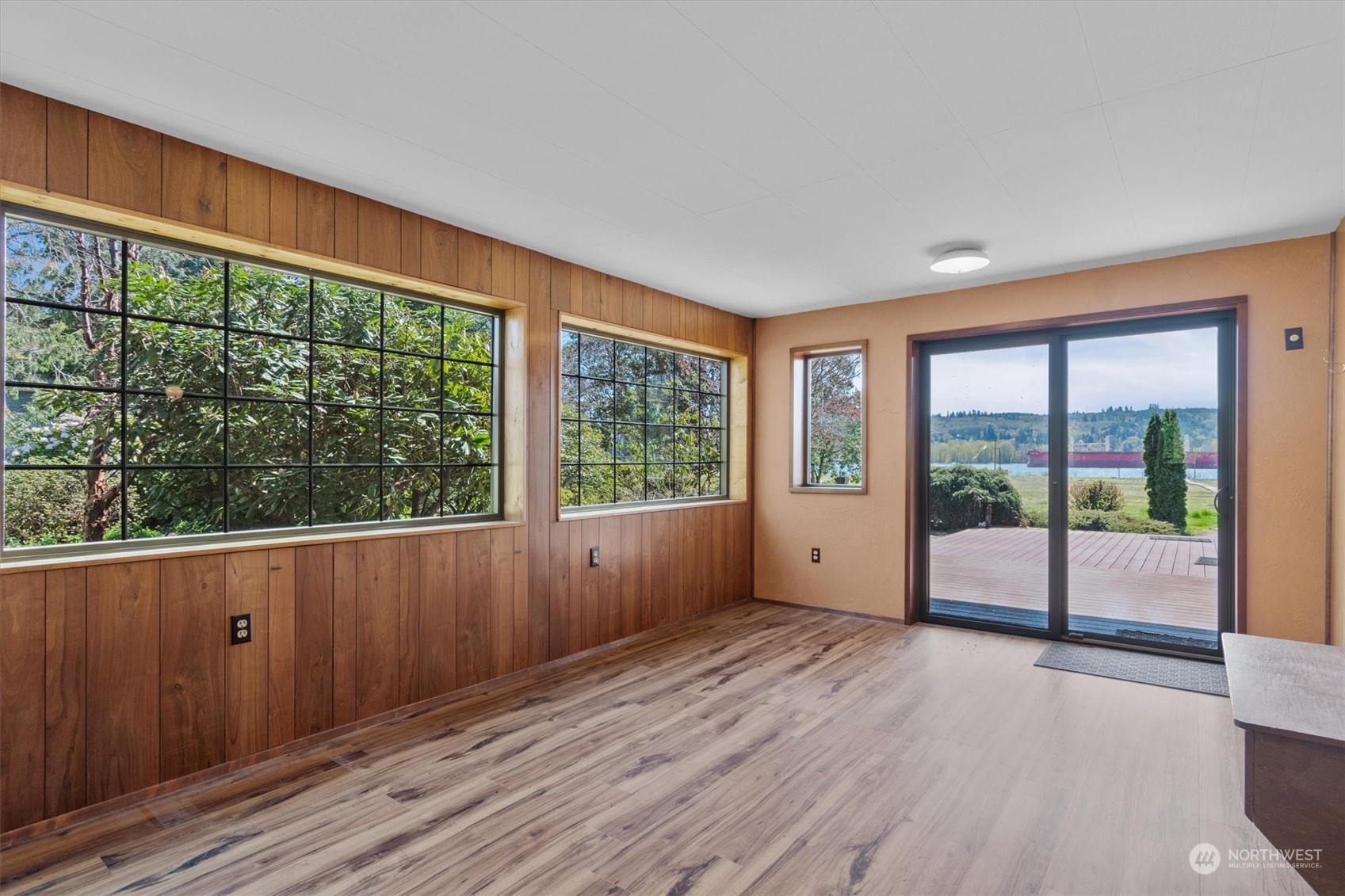 7405 Willow Grove Road Longview, WA 98632 - Photo 34 of 39 a view of an empty room with wooden floor and doors
