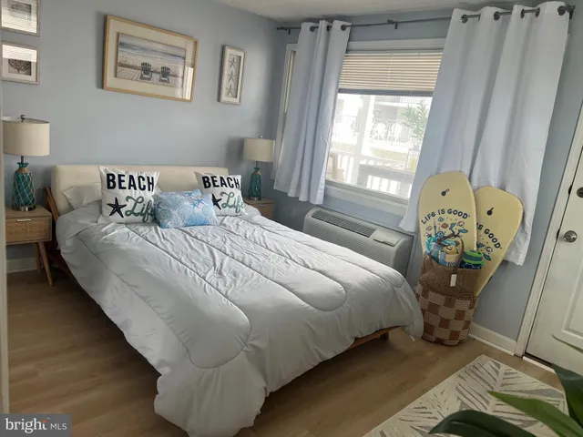 a bedroom with bed and window