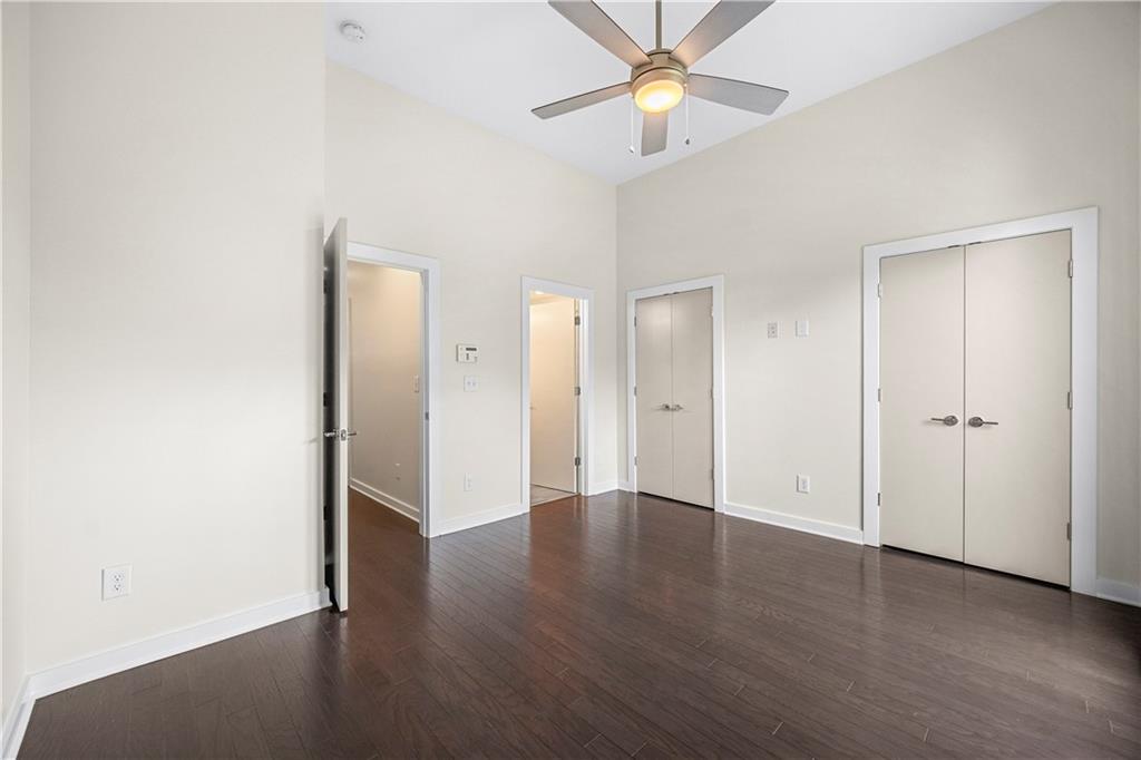 415 Gartrell Street Southeast, Unit 16 Atlanta, GA 30312 - Photo 17 of 29 an empty room with wooden floor and a ceiling fan