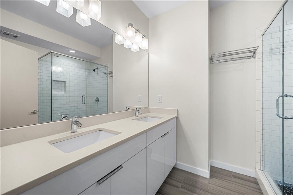 415 Gartrell Street Southeast, Unit 16 Atlanta, GA 30312 - Photo 20 of 29 a bathroom with a sink double vanity and a mirror