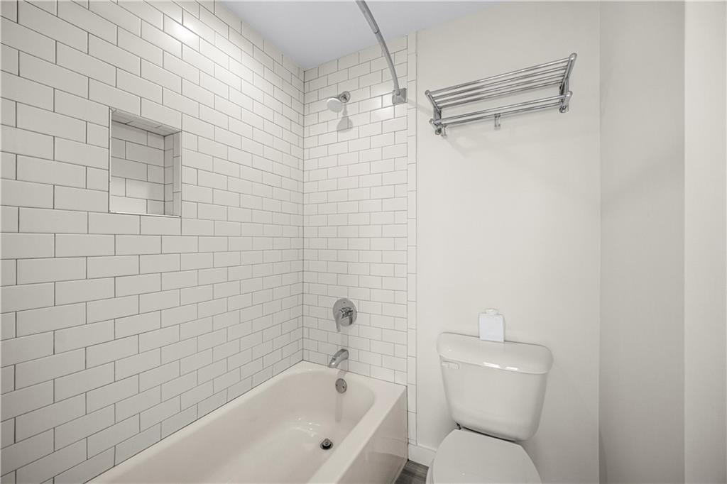415 Gartrell Street Southeast, Unit 16 Atlanta, GA 30312 - Photo 25 of 29 a bathroom with a toilet and shower