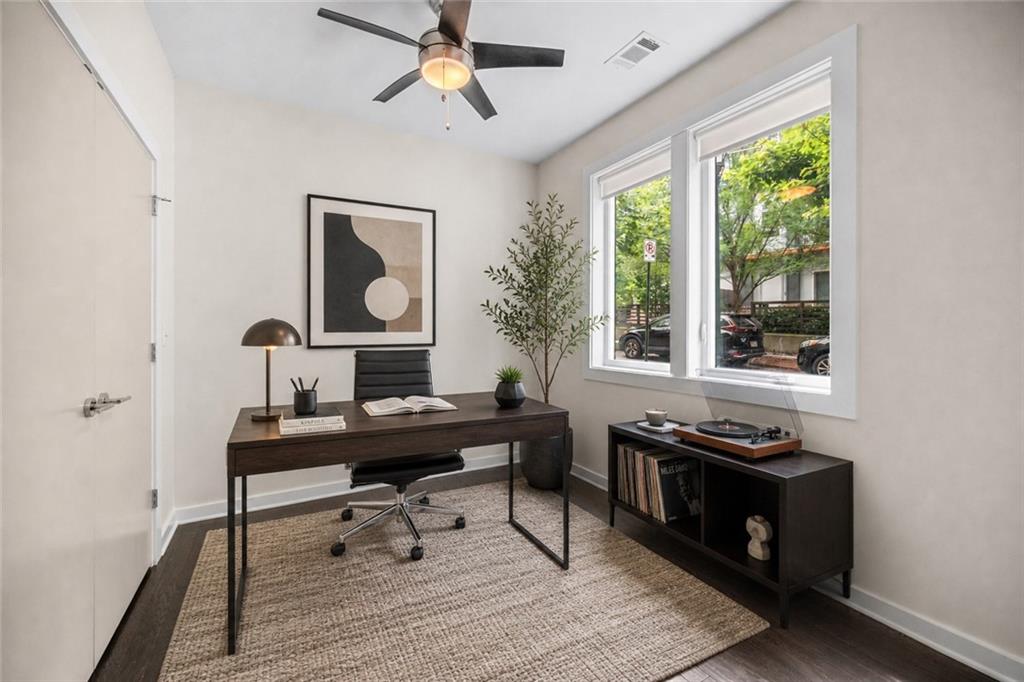 415 Gartrell Street Southeast, Unit 16 Atlanta, GA 30312 - Photo 5 of 29 a view of a workspace with furniture window and wooden floor