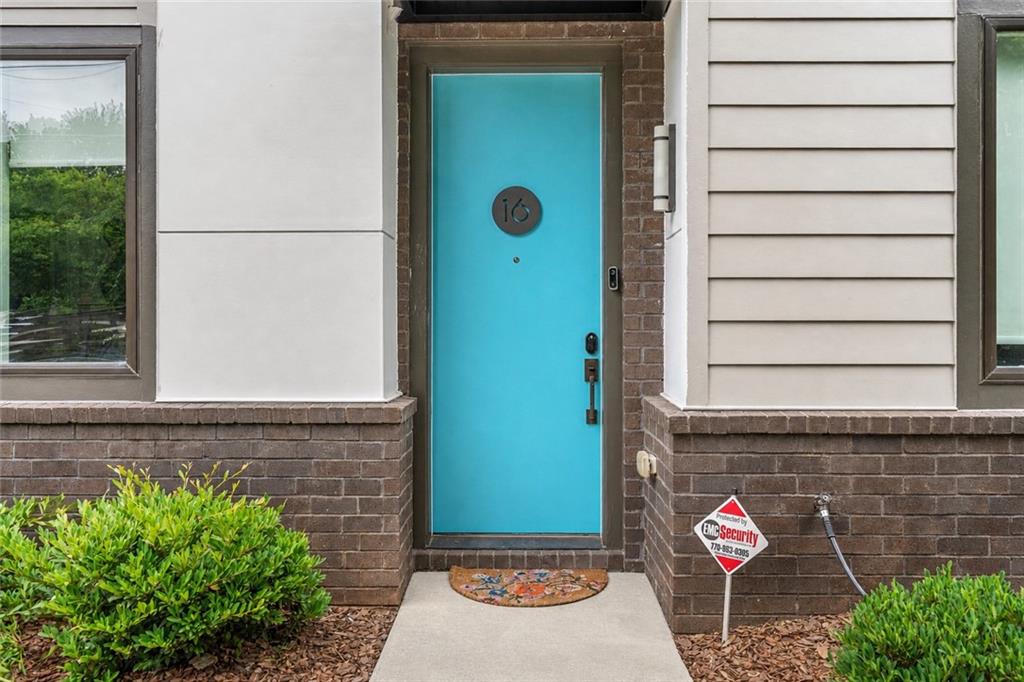 415 Gartrell Street Southeast, Unit 16 Atlanta, GA 30312 - Photo 7 of 29 a view of a door of the house with a potted plant