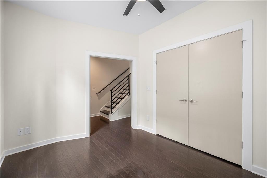 415 Gartrell Street Southeast, Unit 16 Atlanta, GA 30312 - Photo 9 of 29 a view of an empty room with wooden floor
