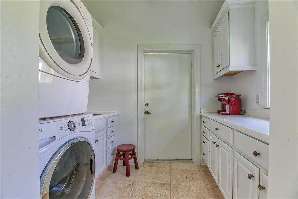 12 Heron's Nest Stuart, FL 34996 - Photo 20 of 43 a utility room with sink dryer and washer