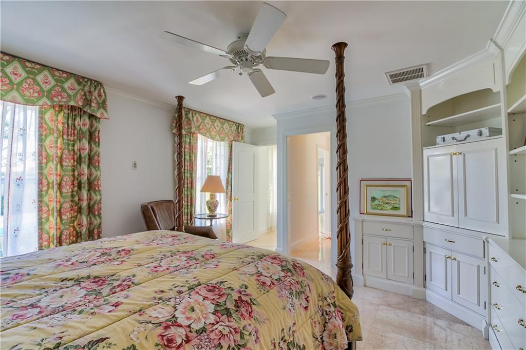 12 Heron's Nest Stuart, FL 34996 - Photo 29 of 43 a bedroom with a bed and a window