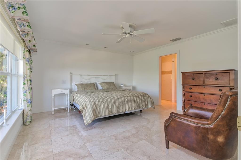 12 Heron's Nest Stuart, FL 34996 - Photo 31 of 43 a bedroom with a bed and closet