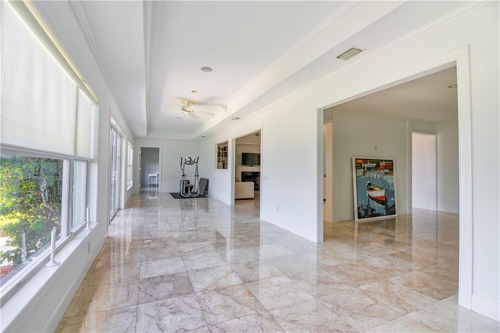 12 Heron's Nest Stuart, FL 34996 - Photo 35 of 43 a view of a hallway with furniture and a window