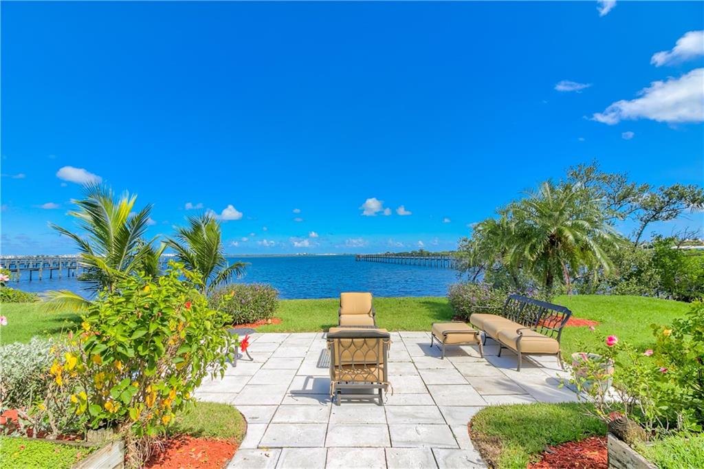 12 Heron's Nest Stuart, FL 34996 - Photo 38 of 43 a patio with table and chairs and potted plants