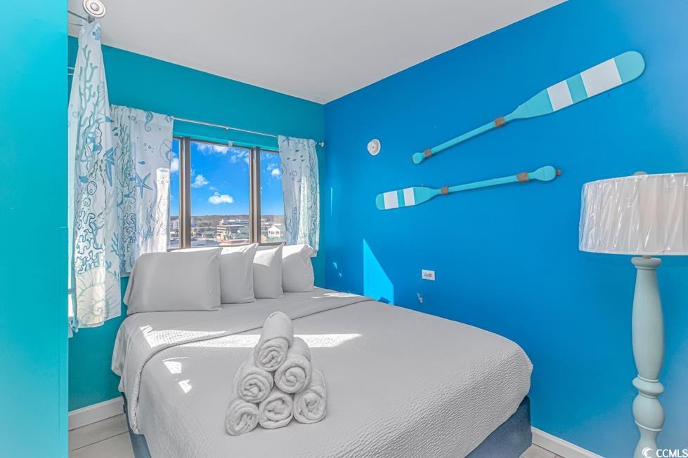 1605 South Ocean Boulevard, Unit 705 Myrtle Beach, SC 29577 - Photo 11 of 38 Bedroom featuring baseboards