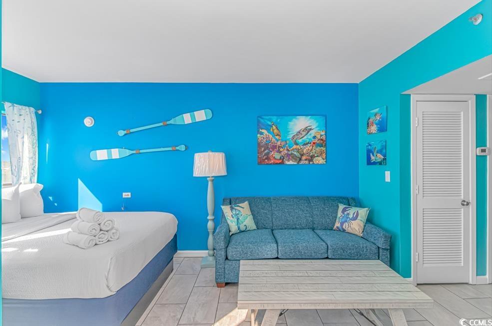 1605 South Ocean Boulevard, Unit 705 Myrtle Beach, SC 29577 - Photo 12 of 38 Bedroom featuring baseboards