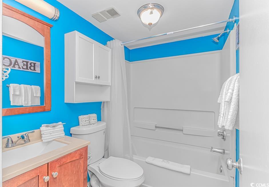 1605 South Ocean Boulevard, Unit 705 Myrtle Beach, SC 29577 - Photo 15 of 38 Bathroom featuring shower / tub combo and vanity