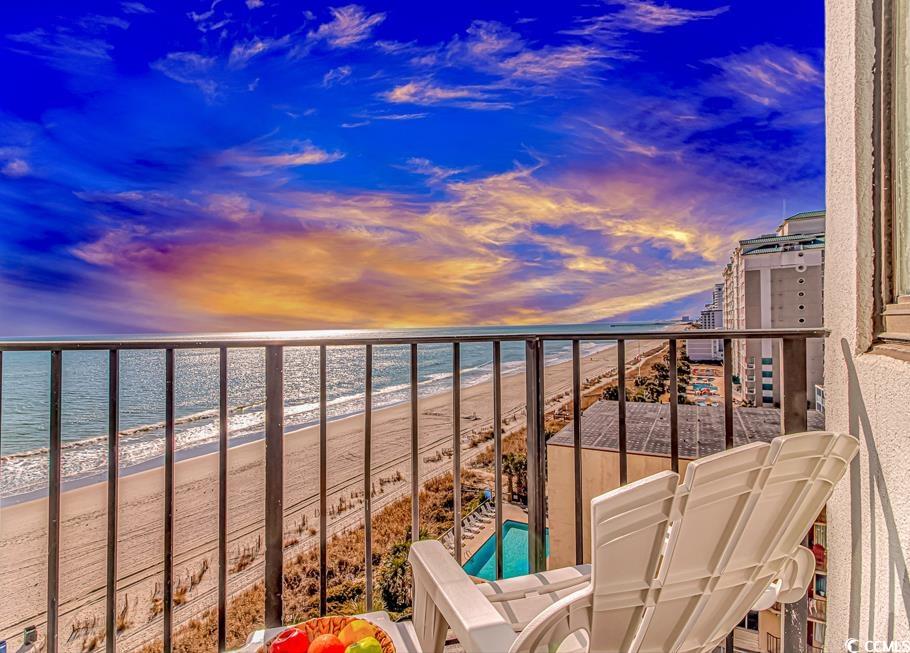 1605 South Ocean Boulevard, Unit 705 Myrtle Beach, SC 29577 - Photo 36 of 38 Balcony at dusk with view of water and beach
