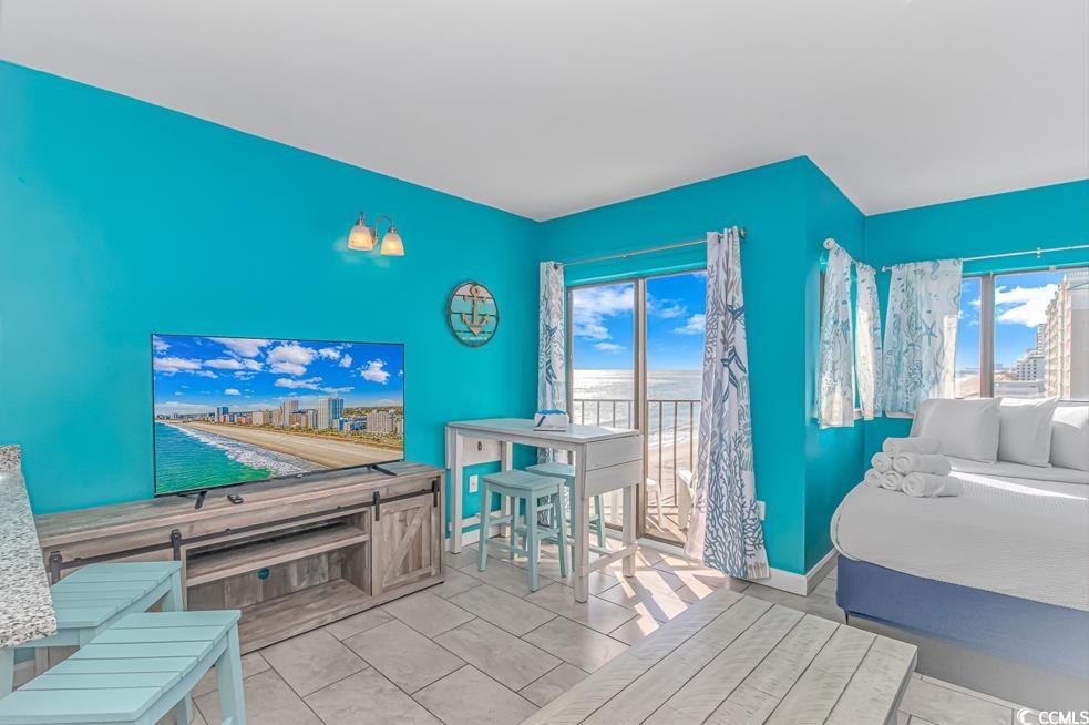 1605 South Ocean Boulevard, Unit 705 Myrtle Beach, SC 29577 - Photo 4 of 38 Tiled bedroom featuring baseboards