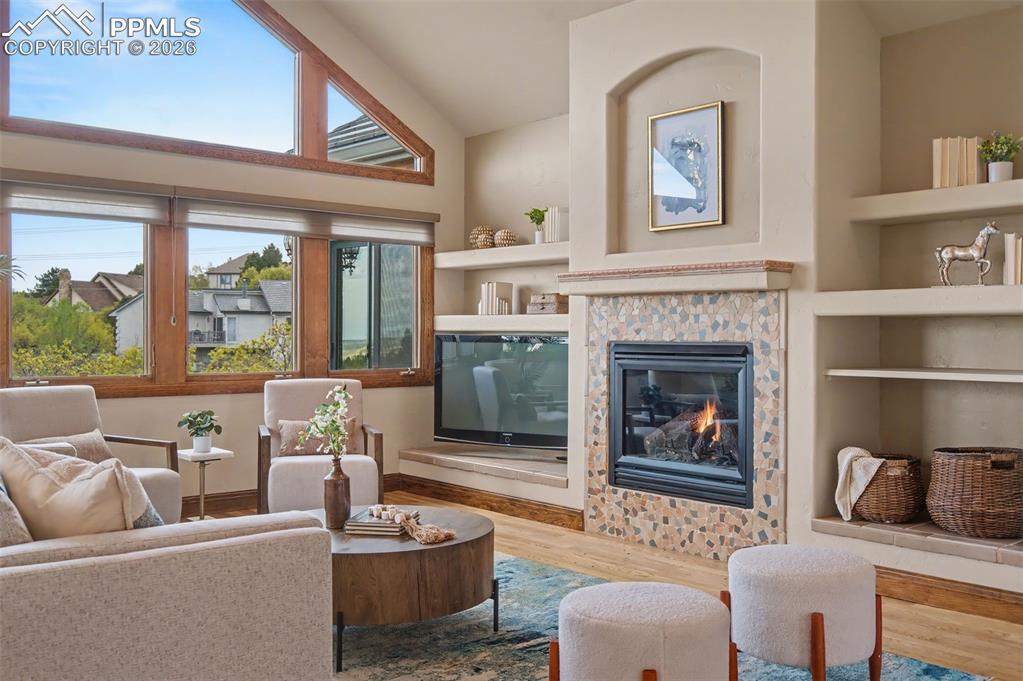 4215 Star Ranch Road Colorado Springs, CO 80906 - Photo 13 of 44 a living room with furniture and a fireplace