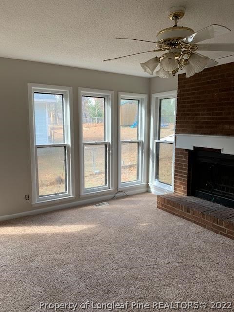 3331 Arrowhead Road Spring Lake, NC 28390 - Photo 12 of 15 a view of an empty room with a fireplace and a window