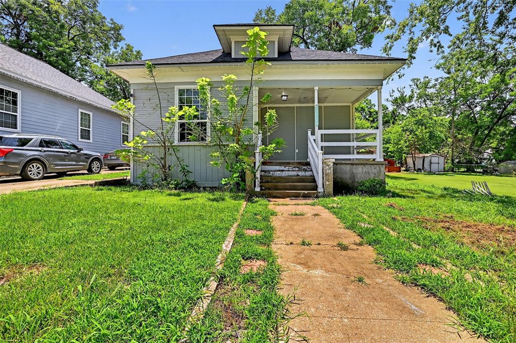 110 Munson Street Denison, TX 75021 - Photo 1 of 1 a front view of a house with garden