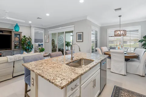 a bedroom with a bed dresser and a window