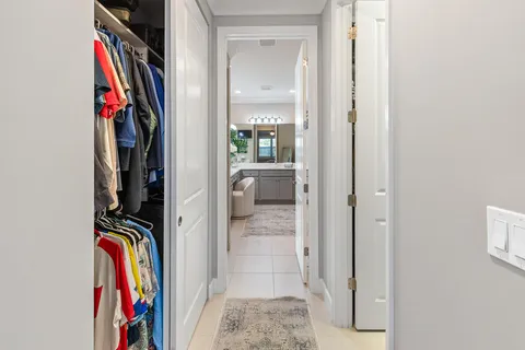 a bathroom with a double vanity sink mirror and shower