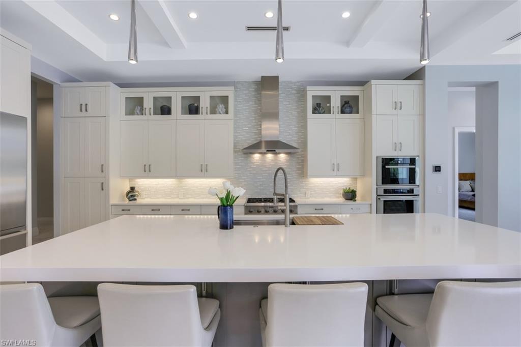 600 Gordonia Road Naples, FL 34108 - Photo 11 of 35 Center island in gourmet kitchen