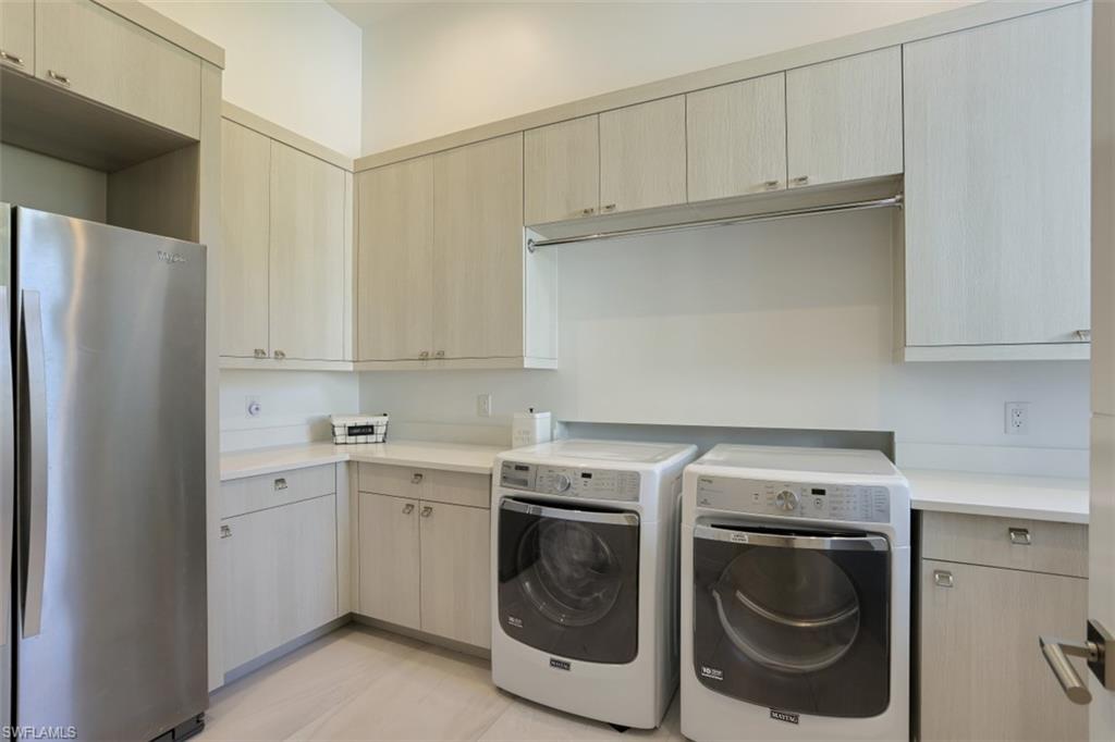 600 Gordonia Road Naples, FL 34108 - Photo 26 of 35 Laundry room with ample storage and extra refrigerator