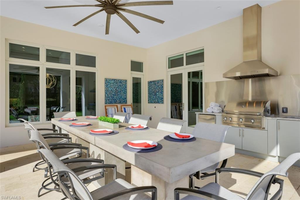 600 Gordonia Road Naples, FL 34108 - Photo 29 of 35 Outdoor kitchen & dining area.