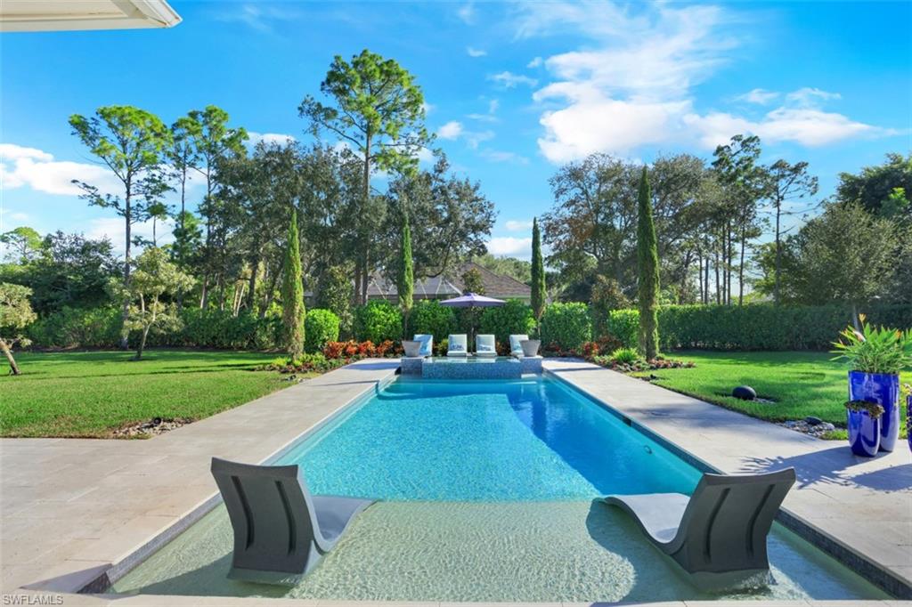 600 Gordonia Road Naples, FL 34108 - Photo 3 of 35 Private lot with pool, spa and outdoor fire bowls.