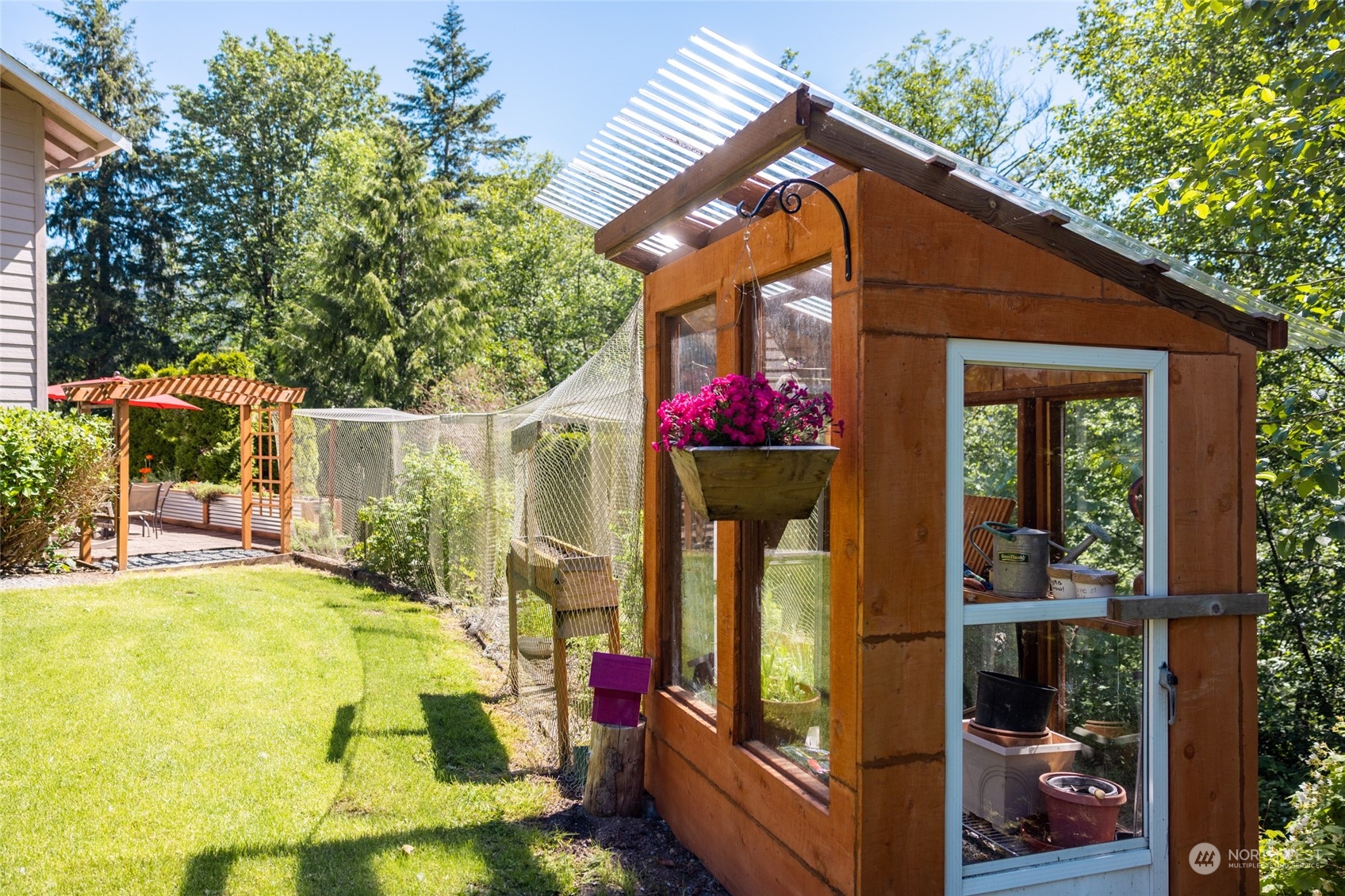 23627 Hoogdal Road Sedro-Woolley, WA 98284 - Photo 26 of 39 a view of a house with sitting area and garden