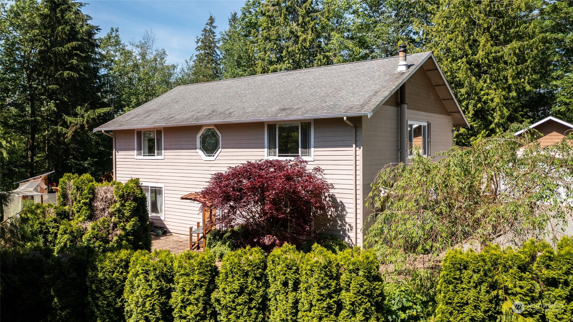 23627 Hoogdal Road Sedro-Woolley, WA 98284 - Photo 3 of 39 a view of a house with a flower garden