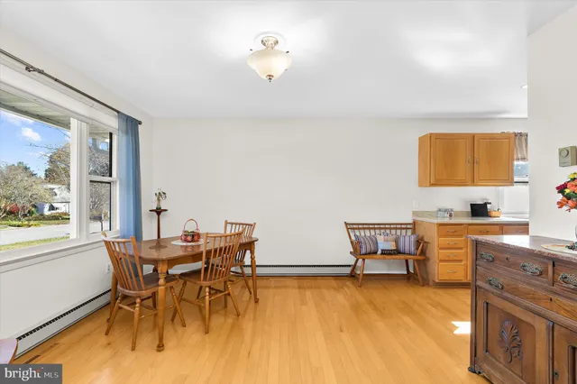 a dining room with furniture and window
