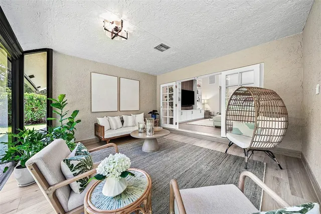 a view of outdoor space with a garden and signage