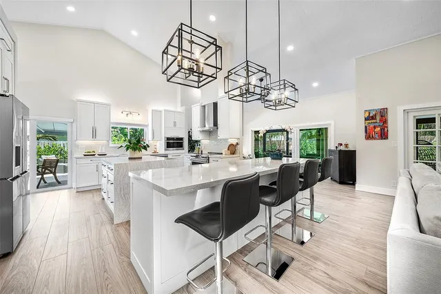 a kitchen with a cabinets and a refrigerator