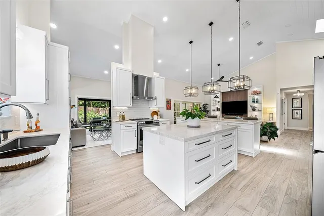 a view of a kitchen with washer and dryer