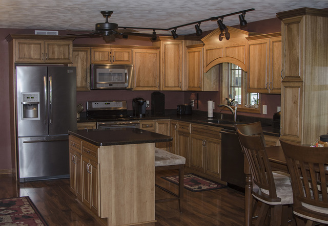 1701 Ridgewood Drive Morrison, IL 61270 - Photo 3 of 19 a kitchen with granite countertop a sink stainless steel appliances and cabinets