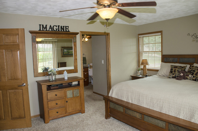 1701 Ridgewood Drive Morrison, IL 61270 - Photo 8 of 19 a bedroom with a bed and a dresser
