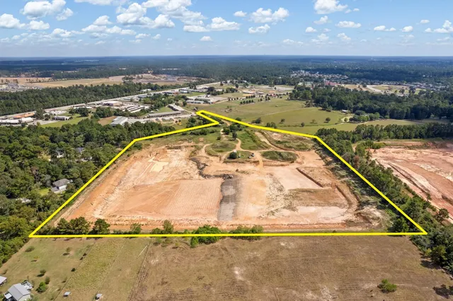 an aerial view of residential building and ocean