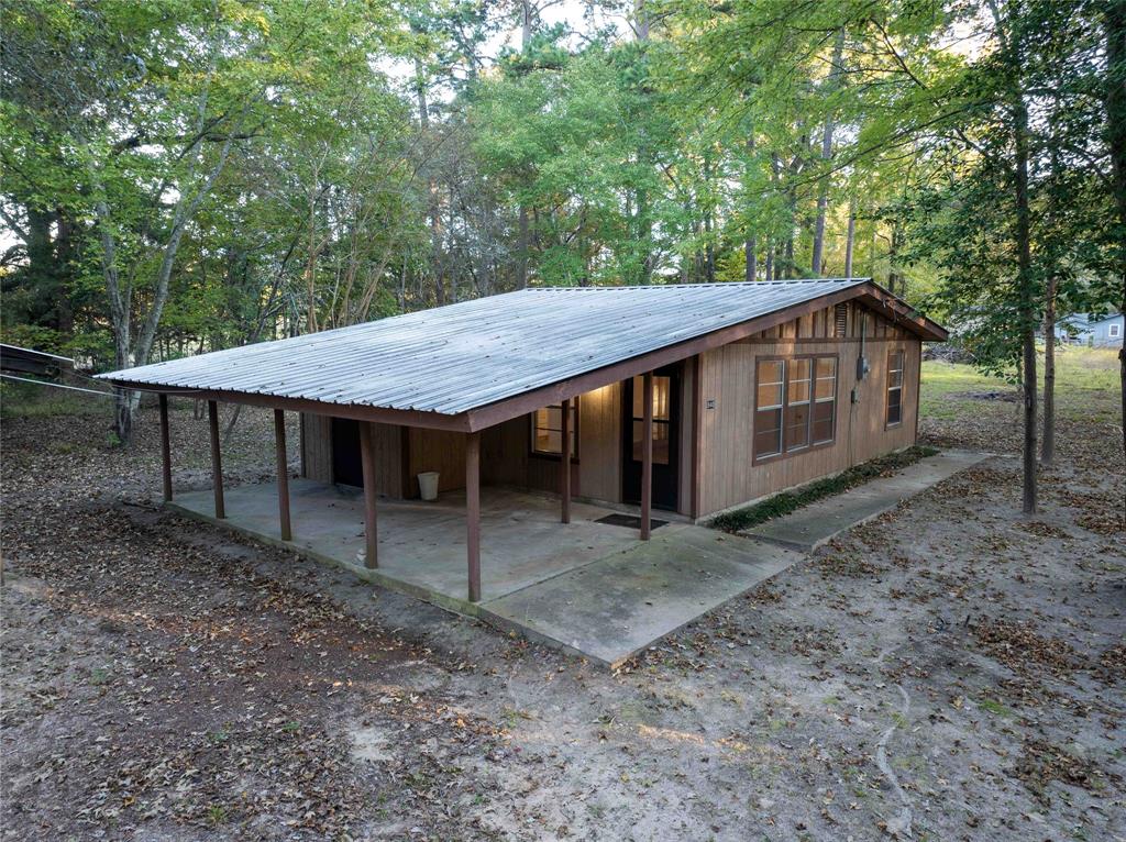 840 Oak Meadow Drive Murchison, TX 75778 - Photo 1 of 27 a view of a barn with a table and chairs