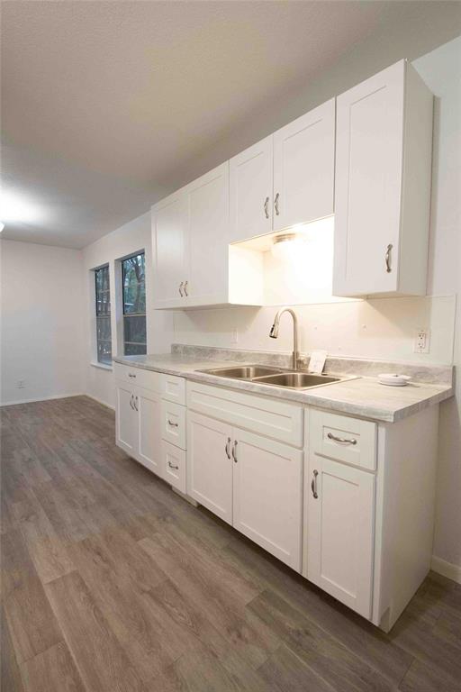 840 Oak Meadow Drive Murchison, TX 75778 - Photo 13 of 27 a kitchen with granite countertop white cabinets and white stainless steel appliances