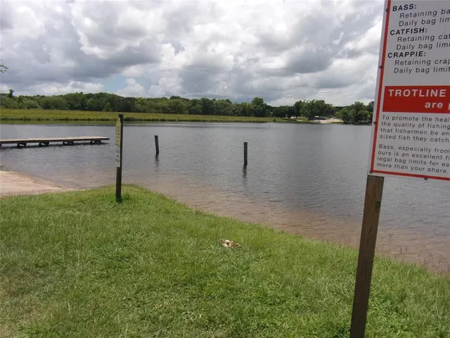 a view of a lake with houses in the back
