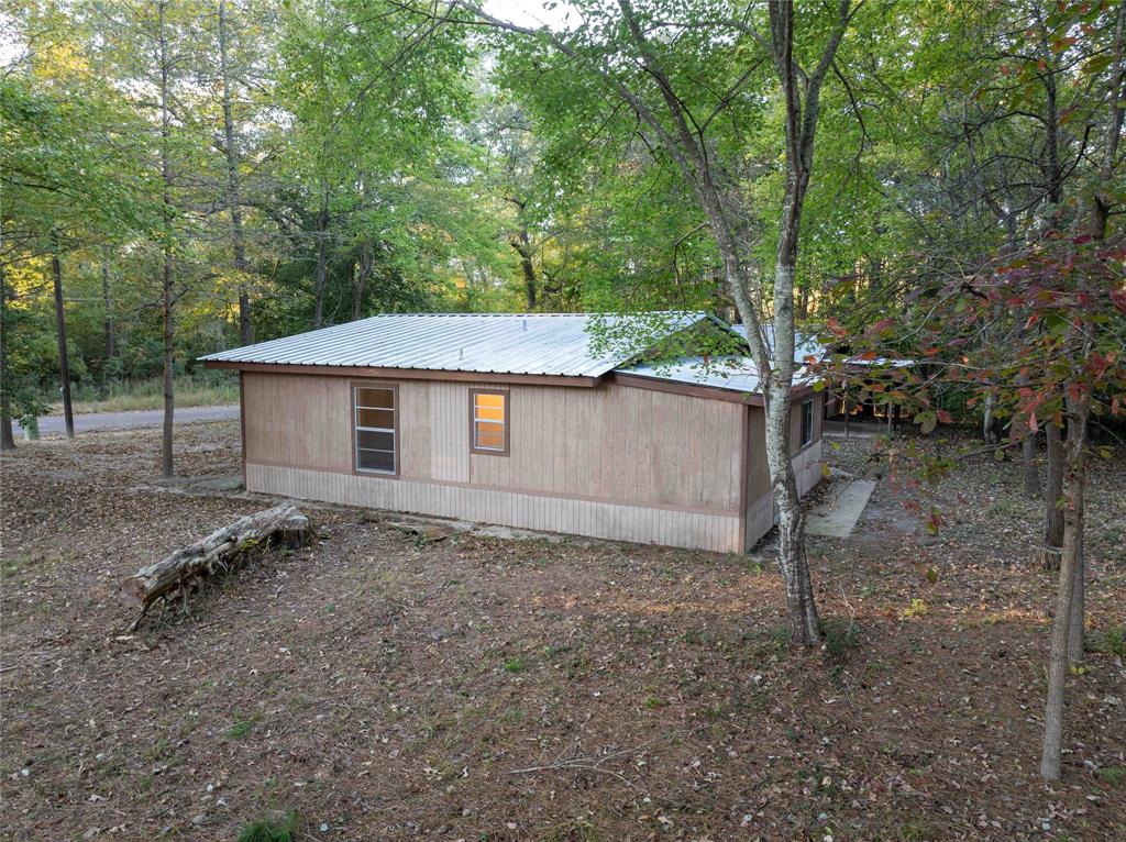 840 Oak Meadow Drive Murchison, TX 75778 - Photo 4 of 27 a backyard of a house with lots of green space