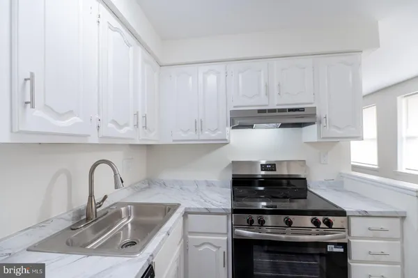 a view of bathroom with a toilet and a sink