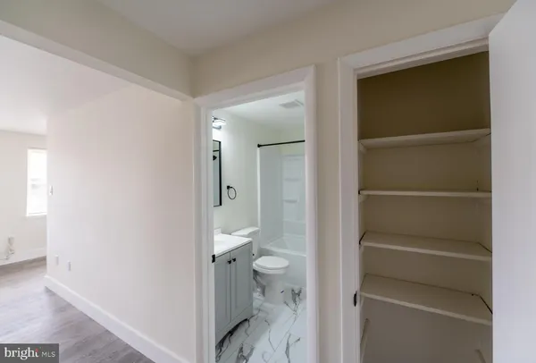 a bathroom with a sink a toilet and a bathtub