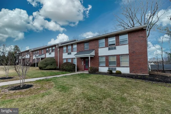 a view of a brick building with entryway