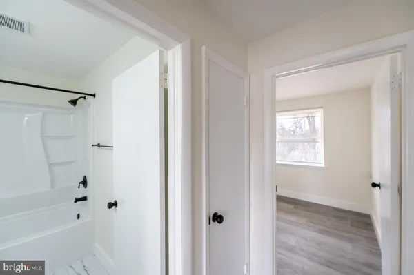 a view of a room that has wooden floor in it