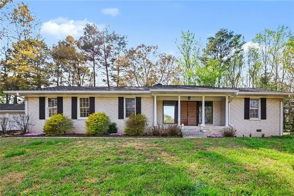 front view of a house with a yard