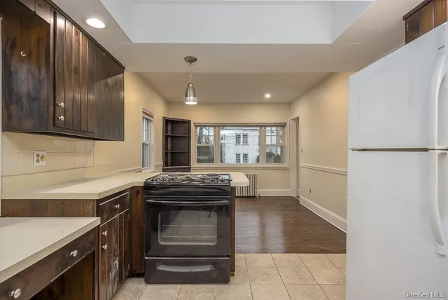 a kitchen with a sink and a stove top oven