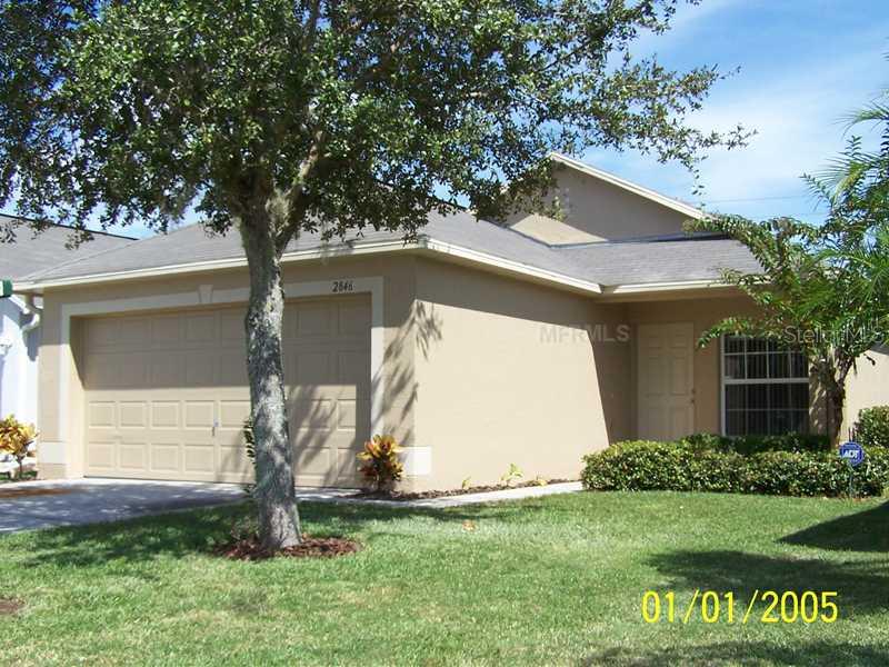 2846 Mingo Drive Land O Lakes, FL 34638 - Photo 1 of 1 a front view of house with a garden