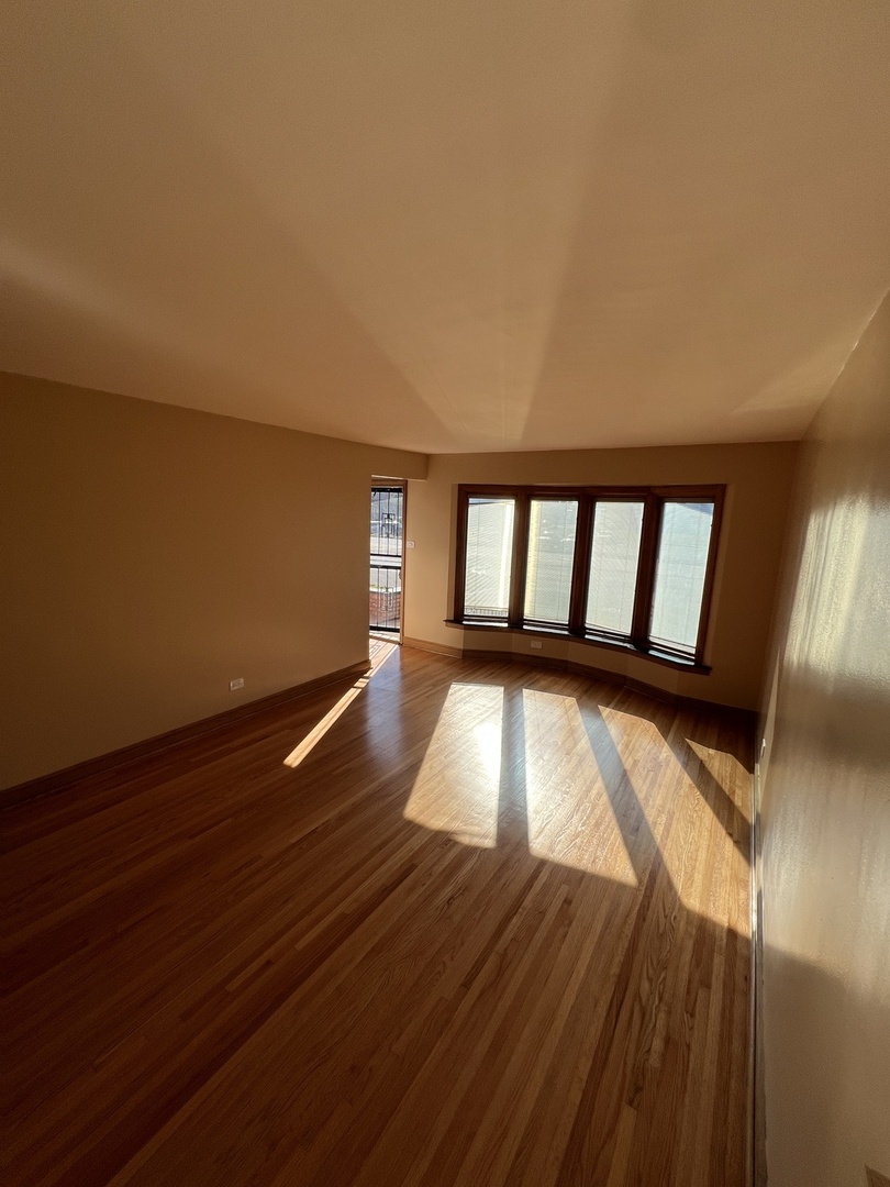 4148 West 87th Street Chicago, IL 60652 - Photo 5 of 16 a view of wooden floor in a room